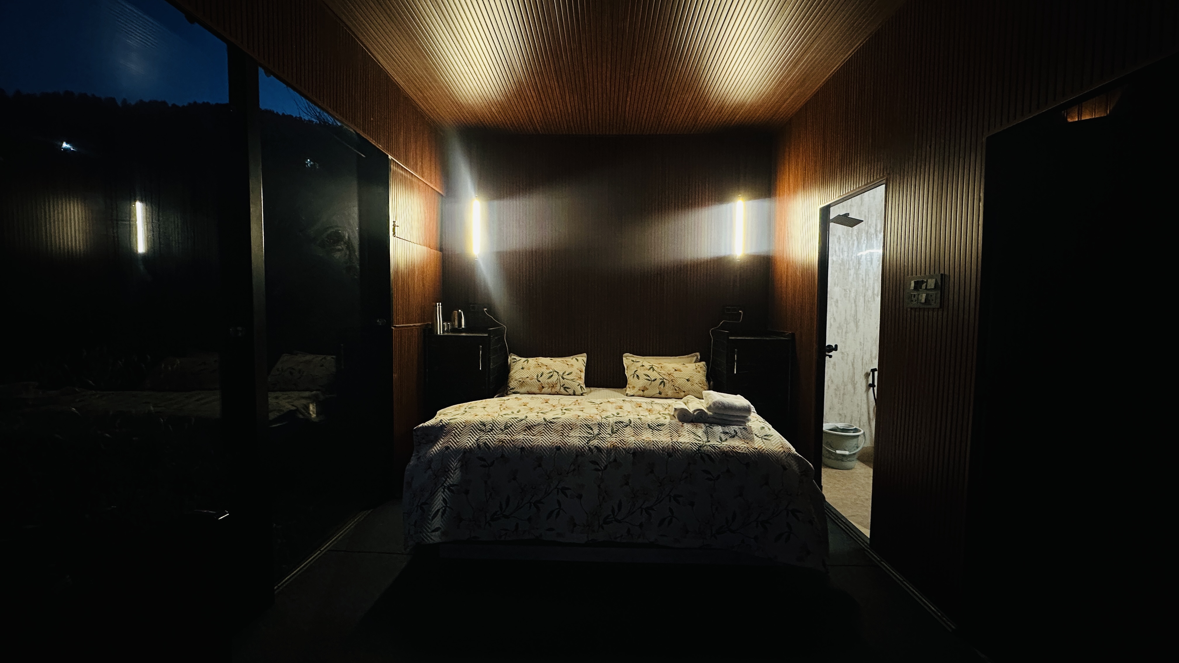 Interior of the Glass Cabin with floor-to-ceiling mountain views