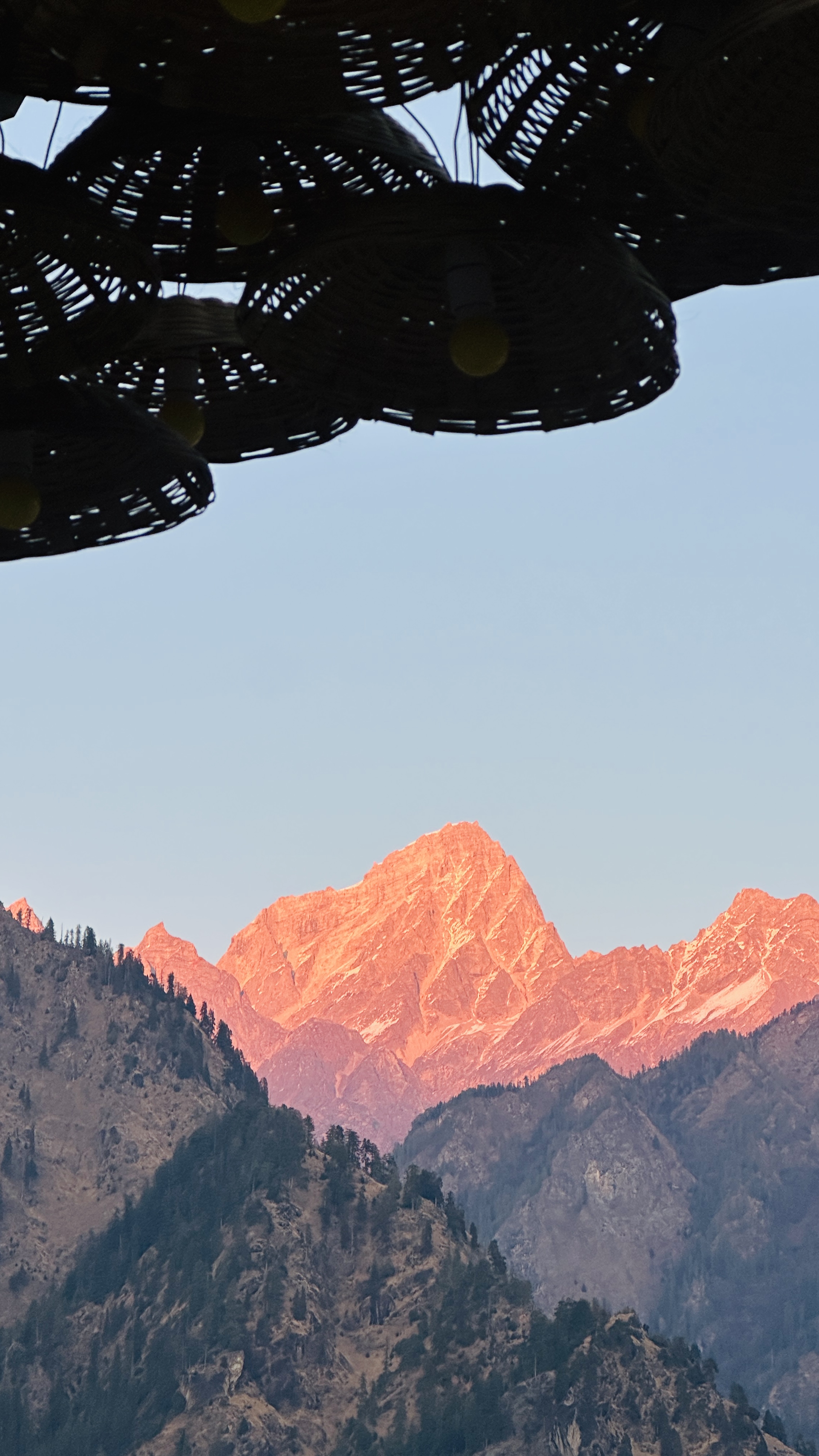 View of the Himalayan peaks through a dome ceiling near Auli
